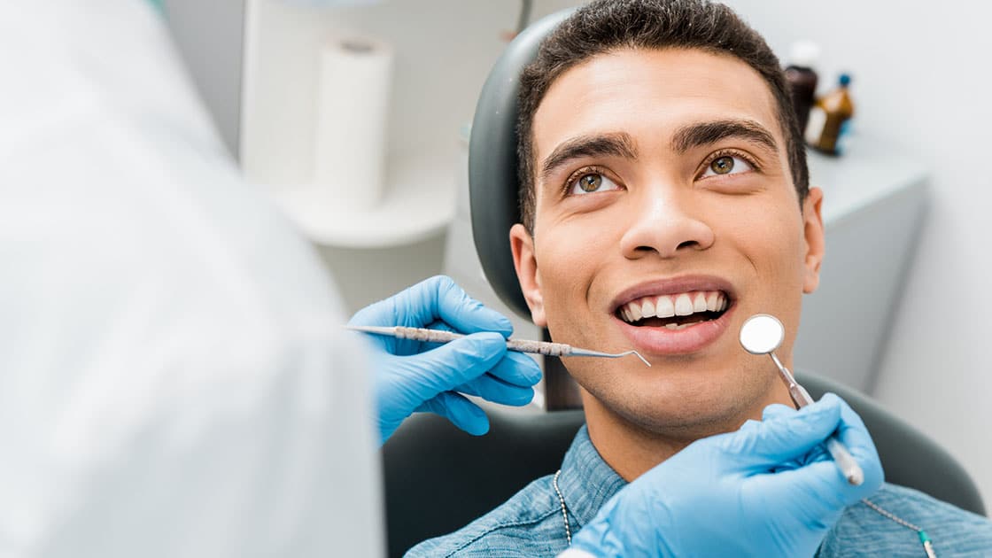 Smiling Man with Dentist