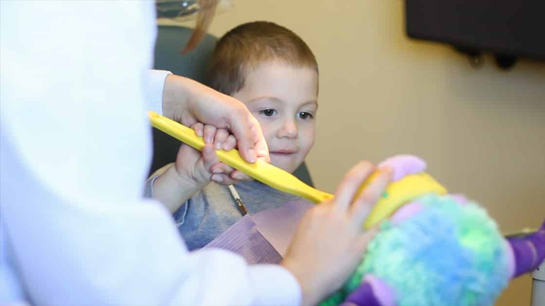 Child Learning to Brush Teeth Photo