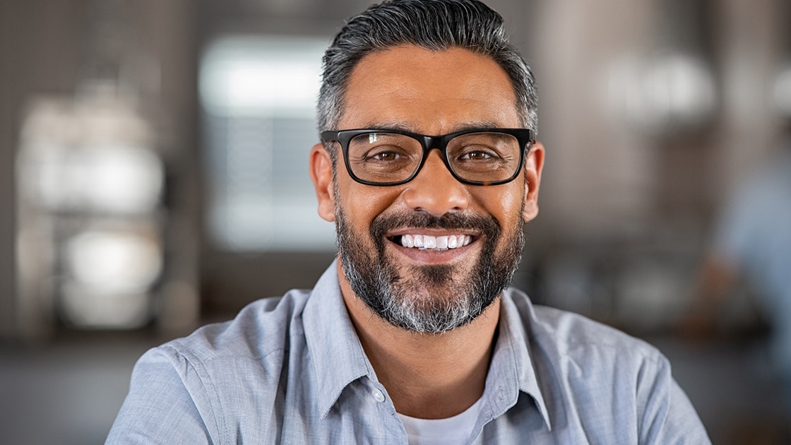 Man With Glasses Smilng at Camera